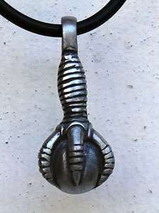 Pewter pendant of Chinese Dragons claw holding magic orb. Detail on 