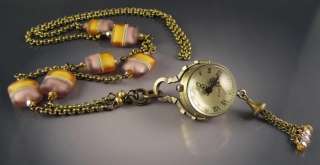 One of a kind long necklace featuring a bubble watch pendant on bronze 