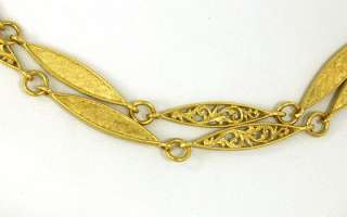 This is an intricate vintage 18k gold ladies chain necklace. The piece 