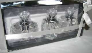 SET OF THREE CLEAR CRYSTAL PERFUME BOTTLES IN A BOX  