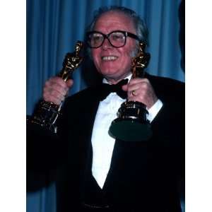 Director/Producer Richard Attenborough Holding Up His Oscars in Press 
