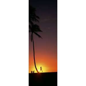 Silhouette of a Woman Running on the Beach, Magic Island, Hawaii, USA 