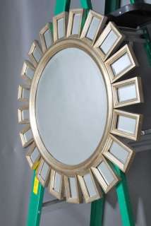   of bevelled mirrors this round beveled mirror has a wood frame